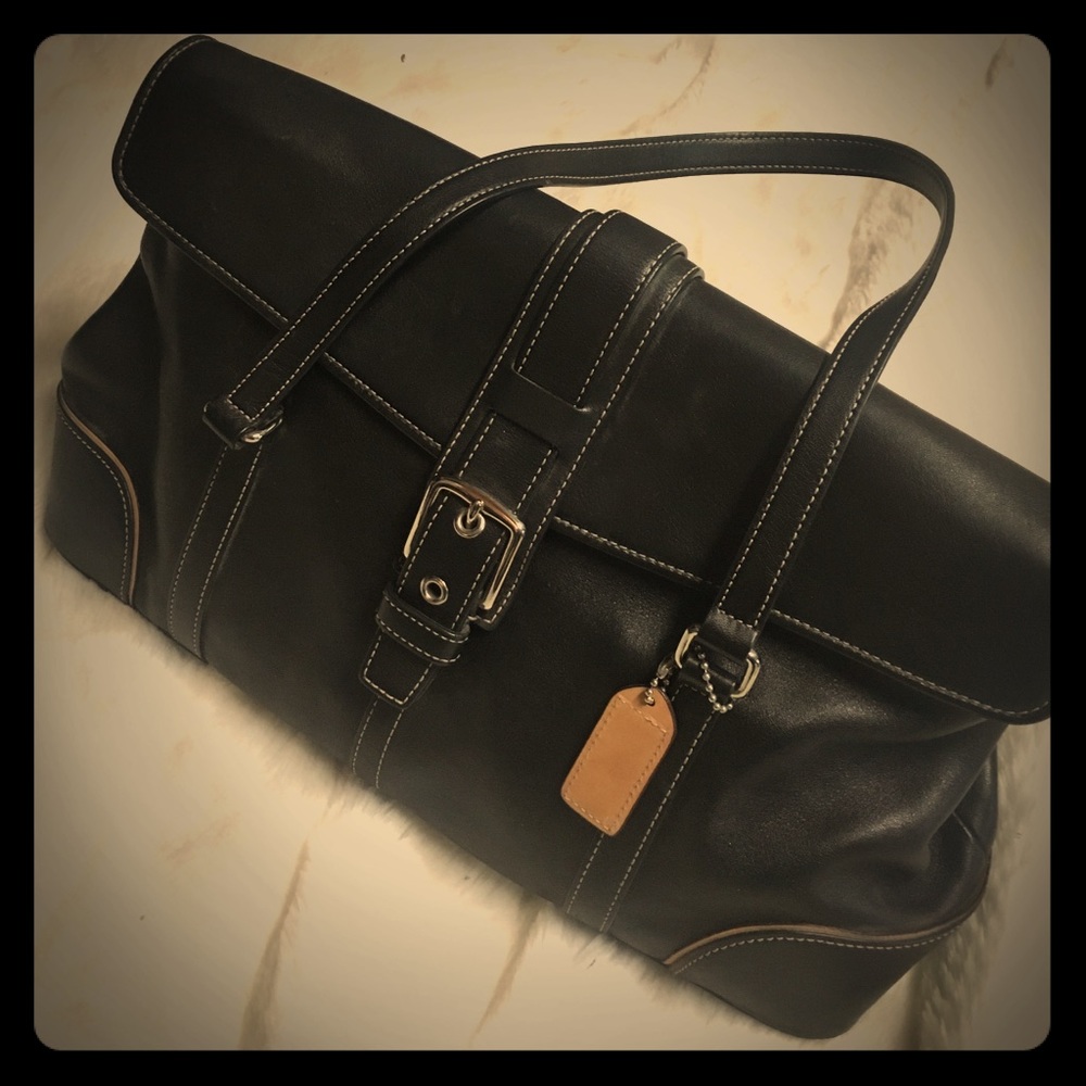 Gently loved Coach bag. Black with tan accents.